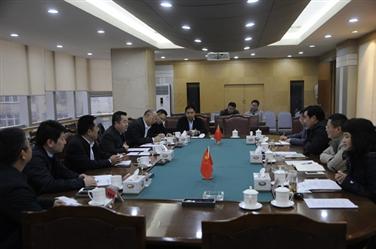 汤明会见成都龙泉驿区委书记廖仁松